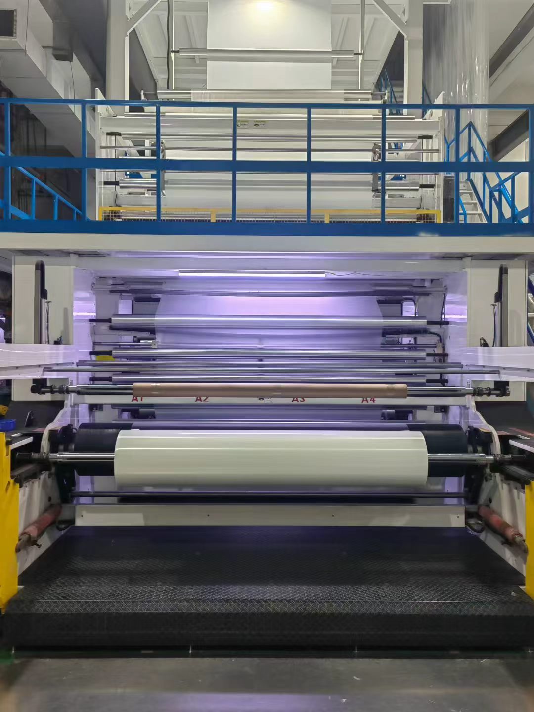 Cast film line winding section with the finished film roll